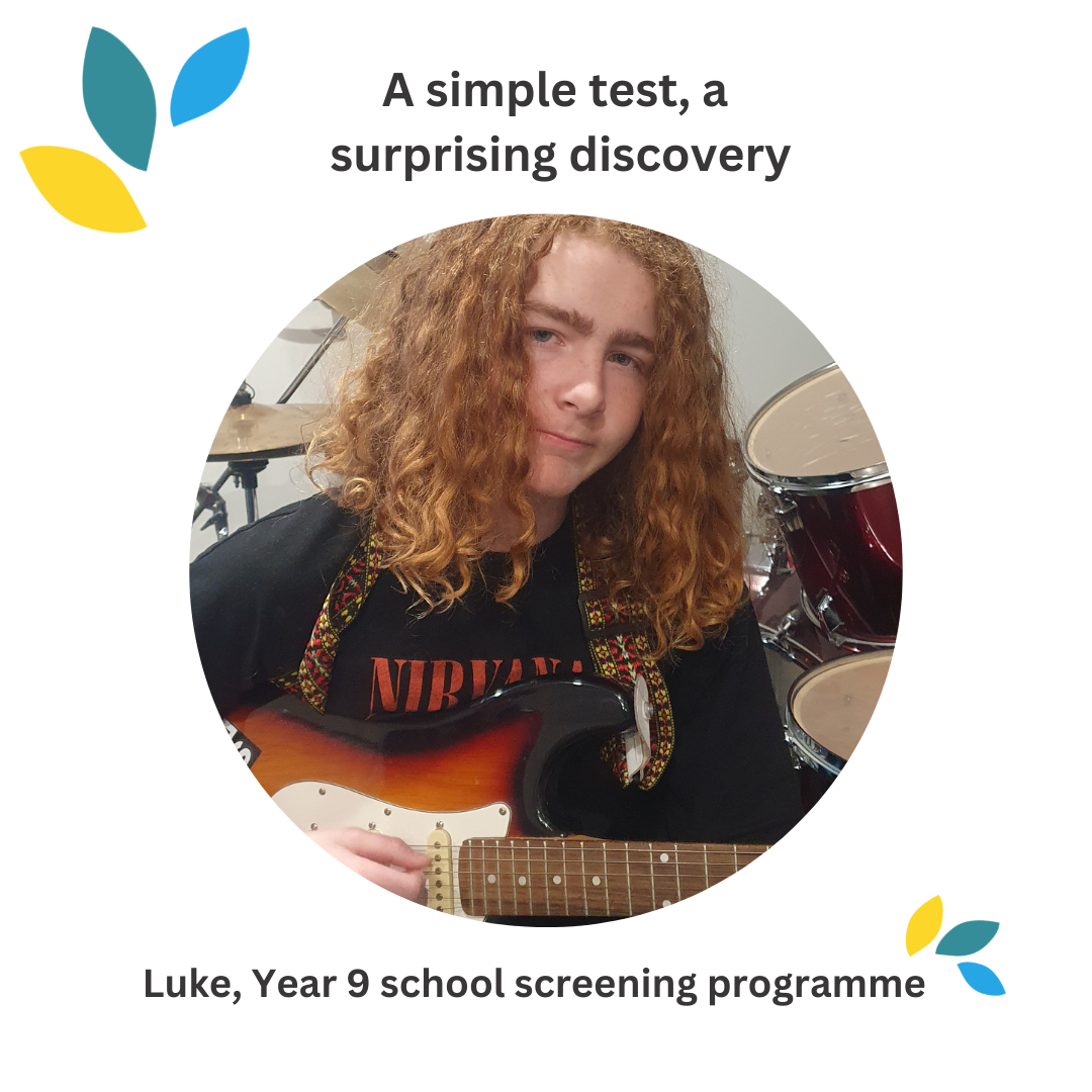 Photo of Luke holding his guitar