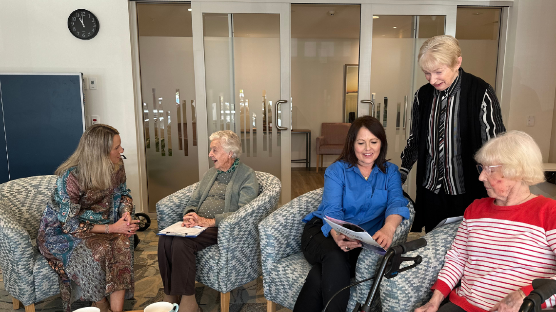 Staff members talking to residents at a Retirement Village.