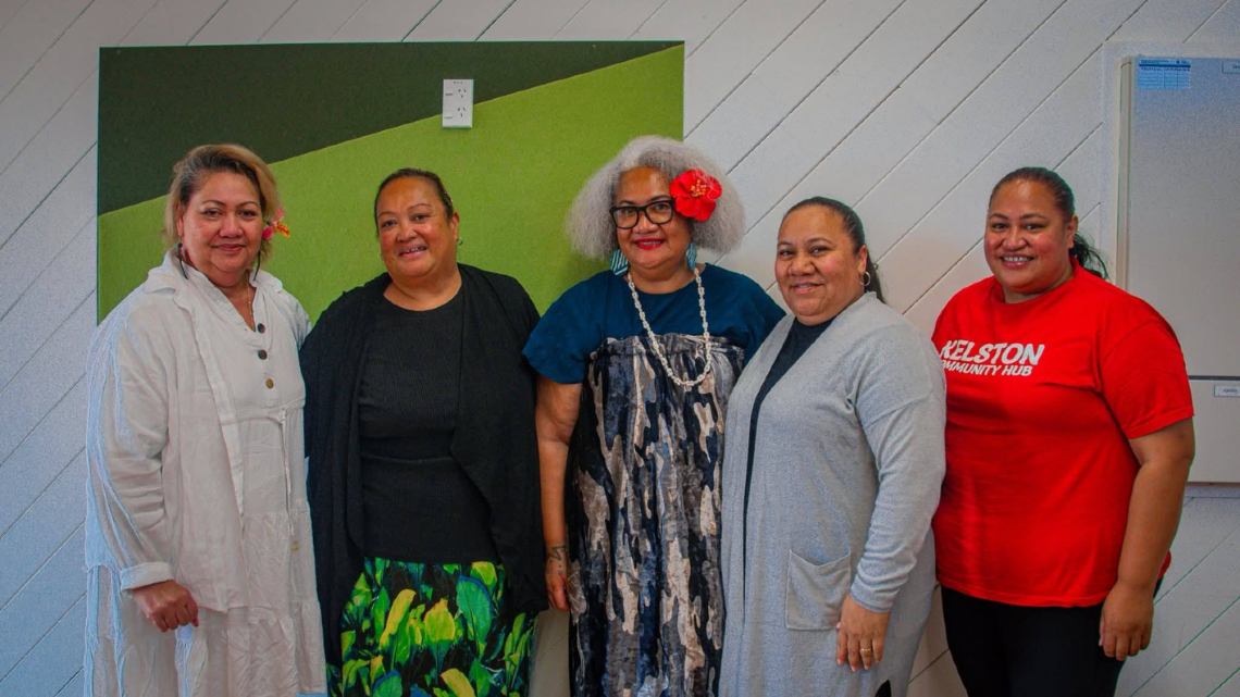 Five women standing at a Pasifika community event.