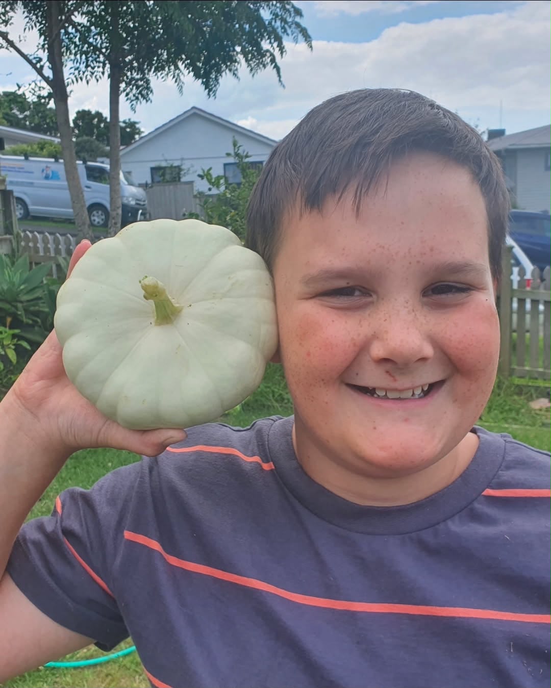 Image of William holding a pumpkin