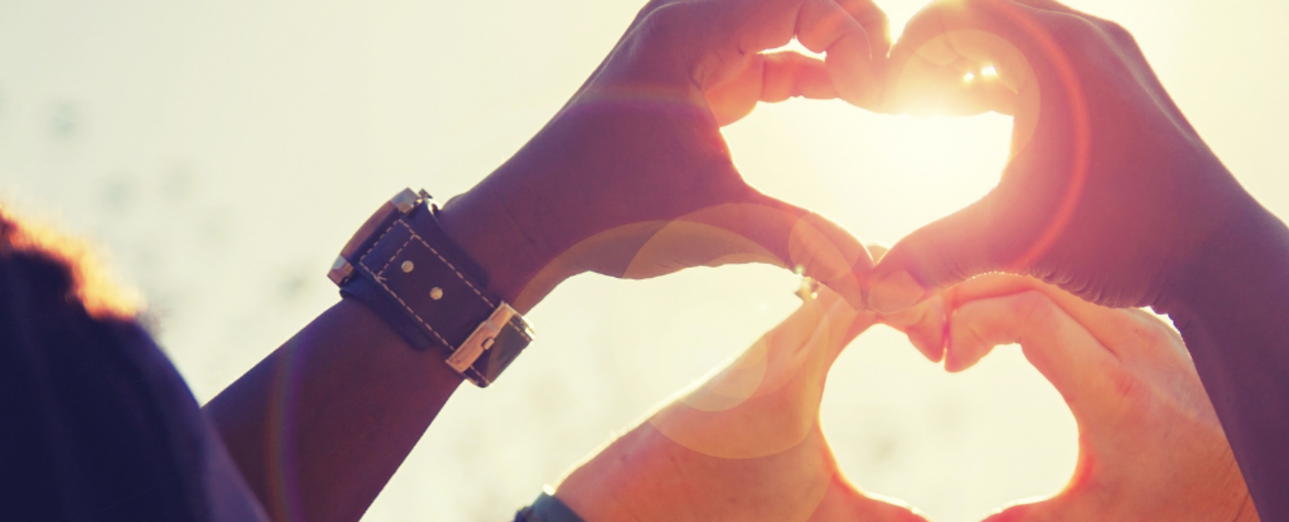 Woman and older man smiling closely together, showing warmth, care, and personal connection.